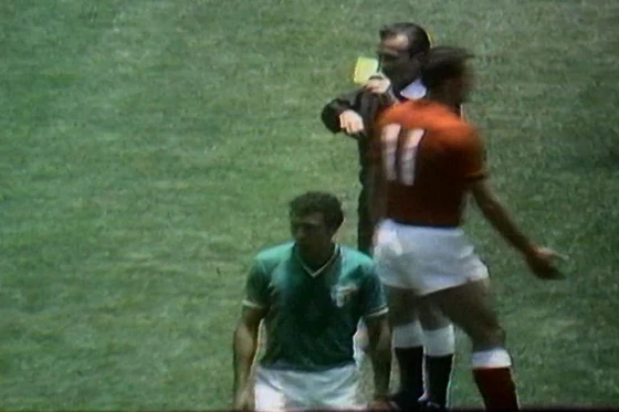 Referee Tschenscher shows Asatiani a yellow card