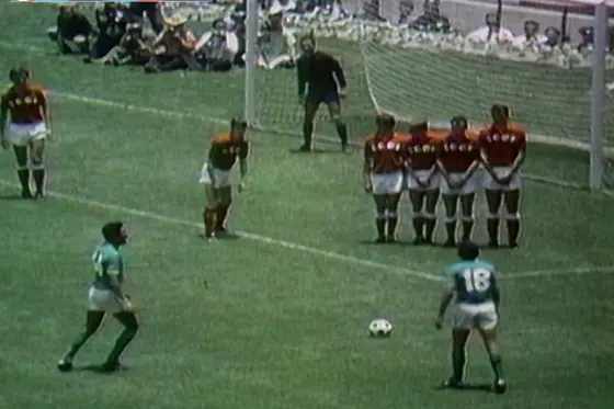 Mexican players prepare to resume the game with an indirect free kick